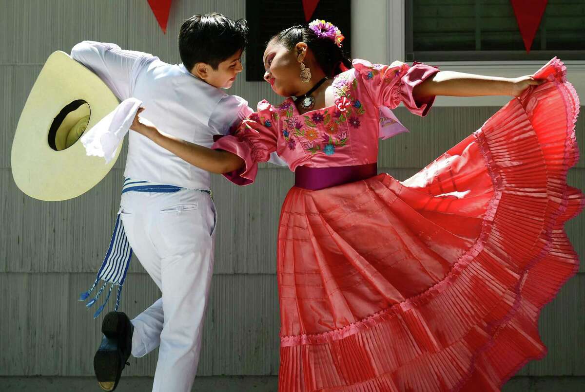 Sebastian Serrano and Alina Mateo perfrom traditional Peruvian dance during the 3rd annual Peruvian Fundraiser hosted for Ready For School Peru Saturday, July 27, 2019, in Norwalk, Conn. The event celebrated Peru’s Independence Day with a delicious Peruvian BBQ, picarones, a dance presentation by the dance studio “Taller de Marinera Norteña”, a special presentation of criolla music singer, games, and raffles. 100% of all proceeds will be donated to Ready For School.