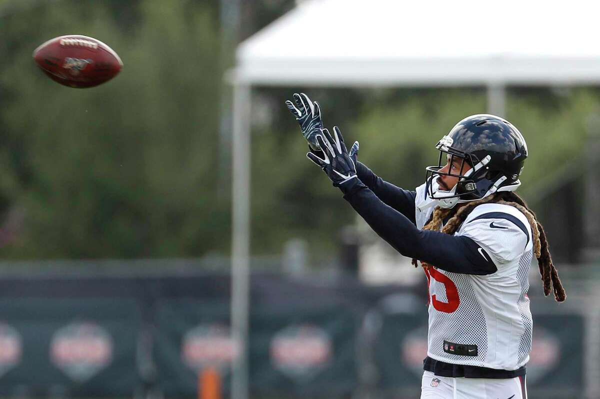 Will Fuller reaches to make a catch during training camp at the Methodist Training Center on Saturday. The wide receiver is expected to play in the season opener.