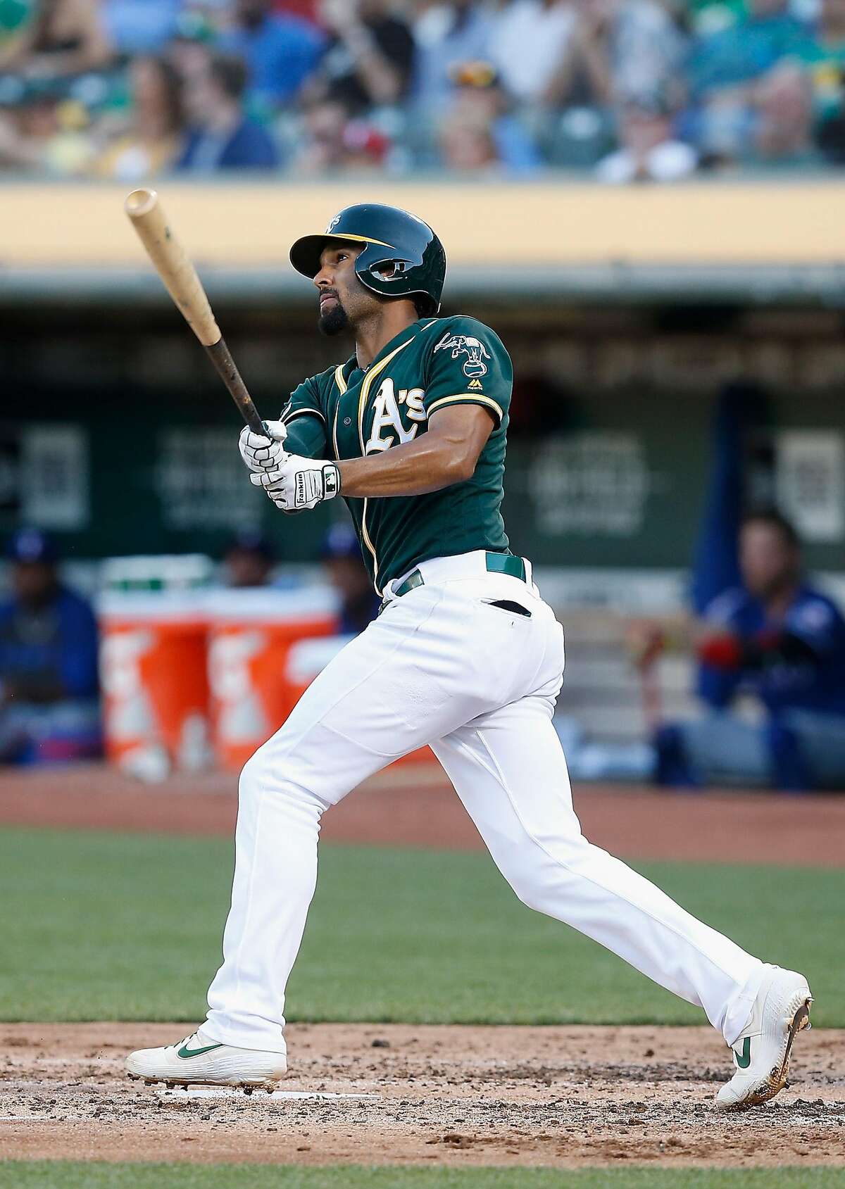 OAKLAND, CALIFORNIA - JULY 27: Marcus Semien #10 of the Oakland Athletics hits a solo home run in the bottom of the third inning against the Texas Rangers at Ring Central Coliseum on July 27, 2019 in Oakland, California. (Photo by Lachlan Cunningham/Getty Images)
