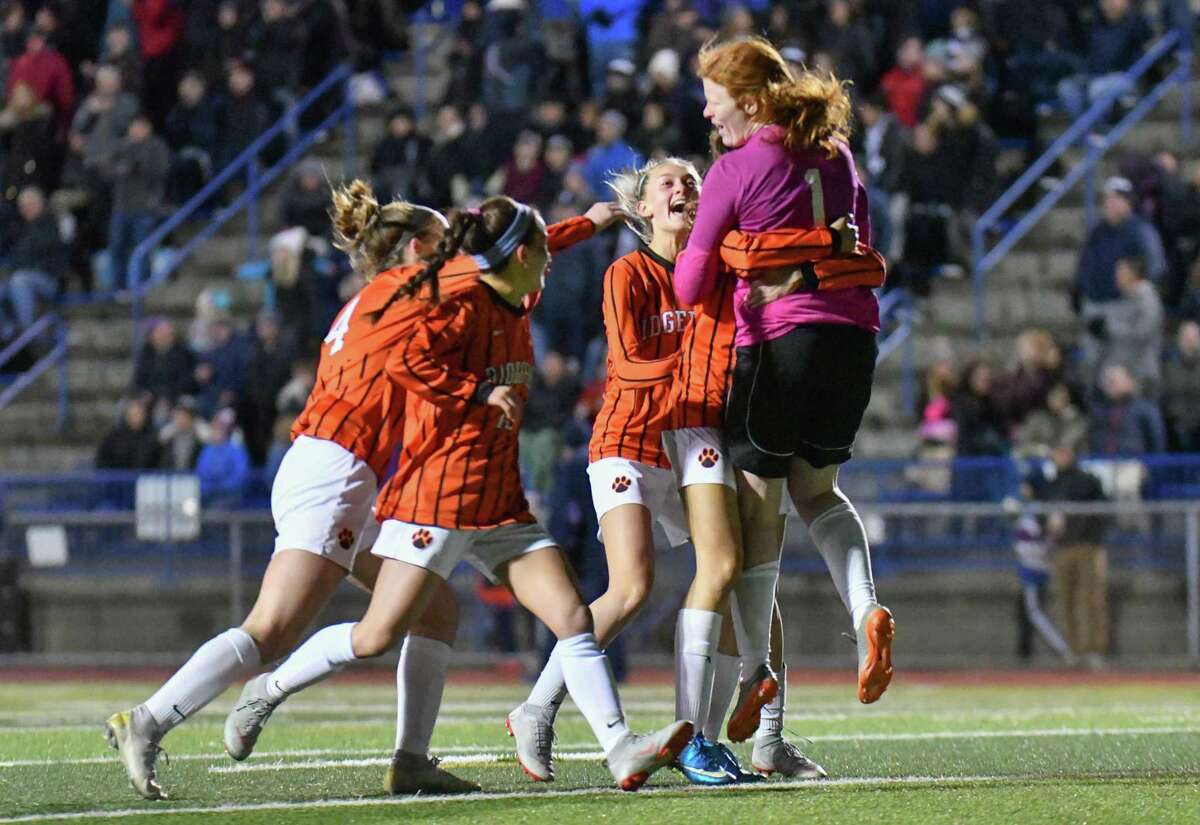 Members of the Ridgefield Tigers celebrate as time runs out during CIAC Class LL Soccer Championship against the Staples Wreckers on Sunday November 18, 2018, at West Haven High School in New Haven, Connecticut.