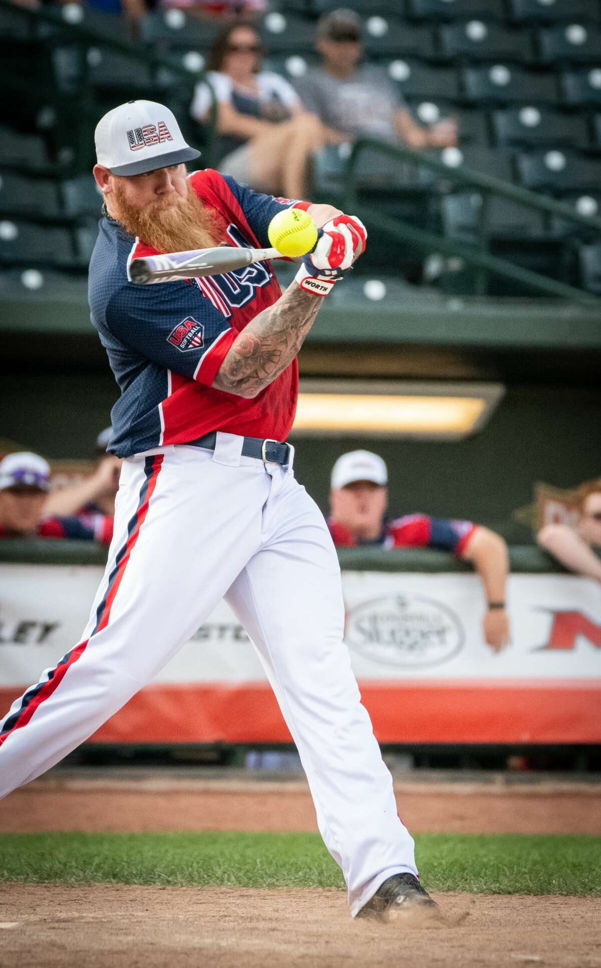 Ryan Harvey of team USA swings on a pitch during a game against Canada in the Border Battle XI at Dow Diamond Saturday, July 27, 2019. (Steven Simpkins/for the Daily News)