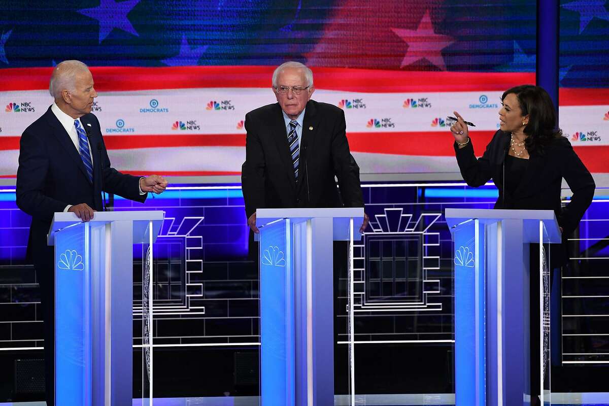 (FILES) In this file photo taken on June 27, 2019 Democratic presidential hopefuls (fromL) former US Vice President Joseph R. Biden Jr., US Senator for Vermont Bernie Sanders and US Senator for California Kamala Harris speak during the second Democratic primary debate of the 2020 presidential campaign season hosted by NBC News at the Adrienne Arsht Center for the Performing Arts in Miami, Florida. - Democrats are gearing up for their second primary debates ahead of the 2020 election, with a rematch looming between frontrunner Joe Biden and first round star Kamala Harris. Ten candidates including Senators Elizabeth Warren and Bernie Sanders will square off in Detroit on July 30, while Biden and Harris will share the stage with eight others the following night, after a draw of eligible participants by debate hosts CNN on July 18, 2019. (Photo by SAUL LOEB / AFP)SAUL LOEB/AFP/Getty Images