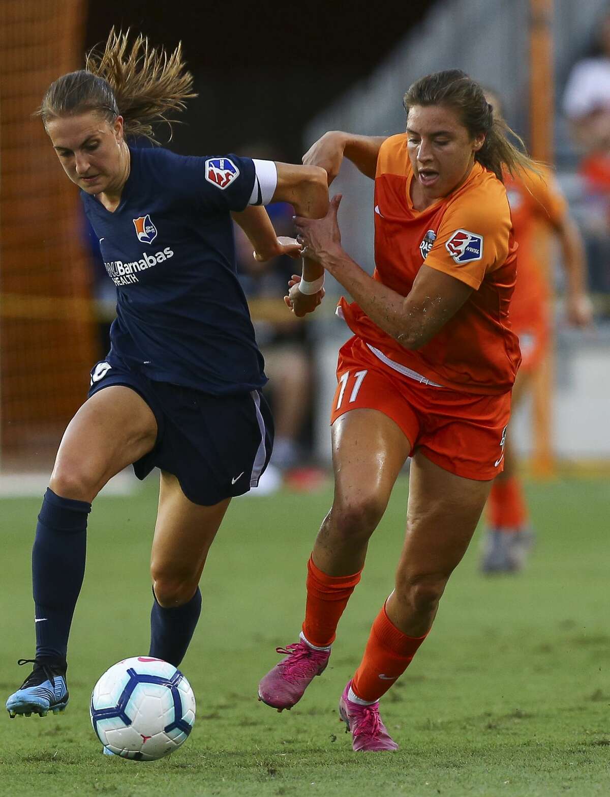 Sky Blue FC midfielder Sarah Killion (16) and Houston Dash midfielder Sofia Huerta (11) battle for control of the ball during the first half of an NWSL match at BBVA Stadium Sunday, July 28, 2019, in Houston.