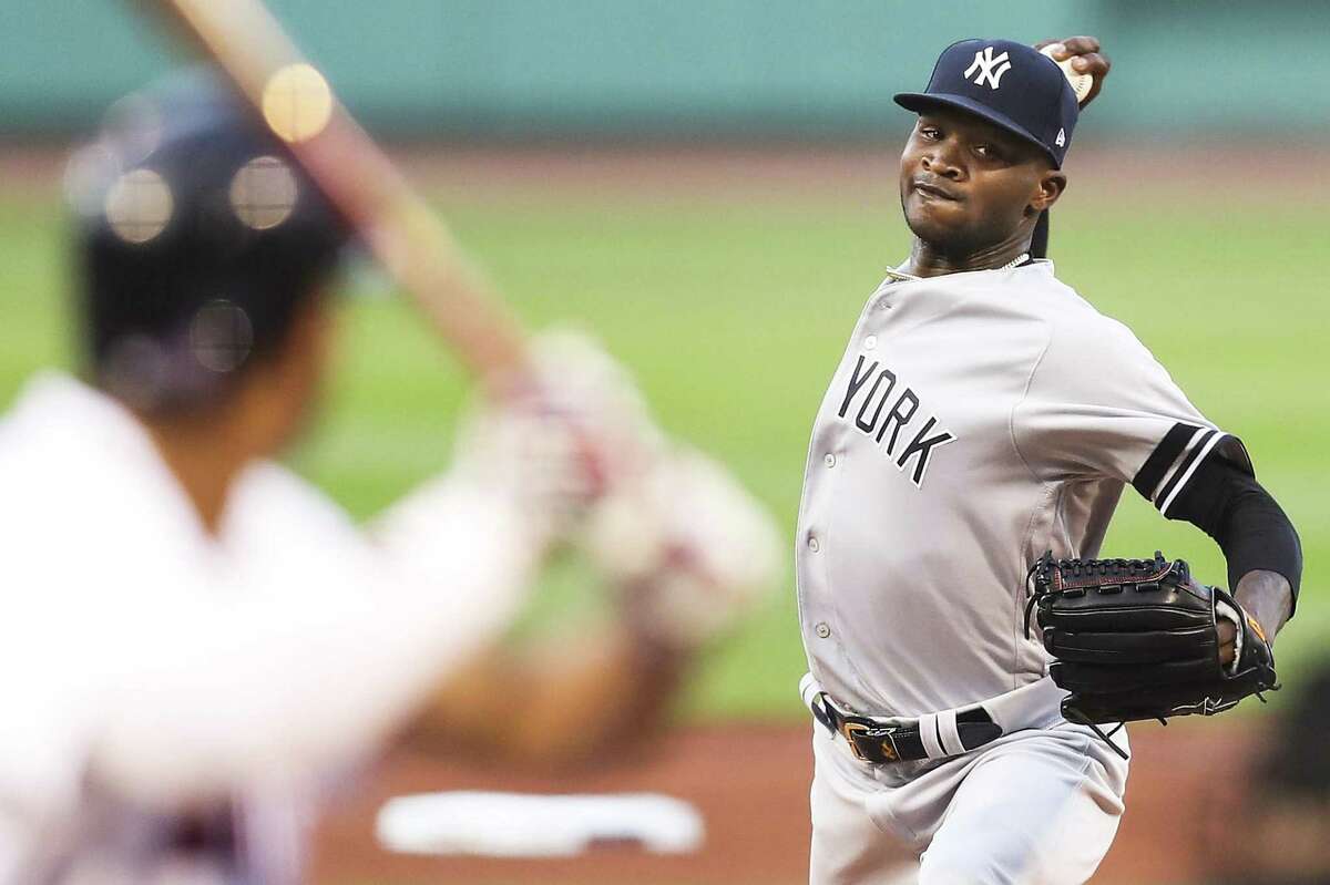 Domingo German of the Yankees pitches in the first inning against the Red Sox at Fenway Park on Sunday night in Boston.