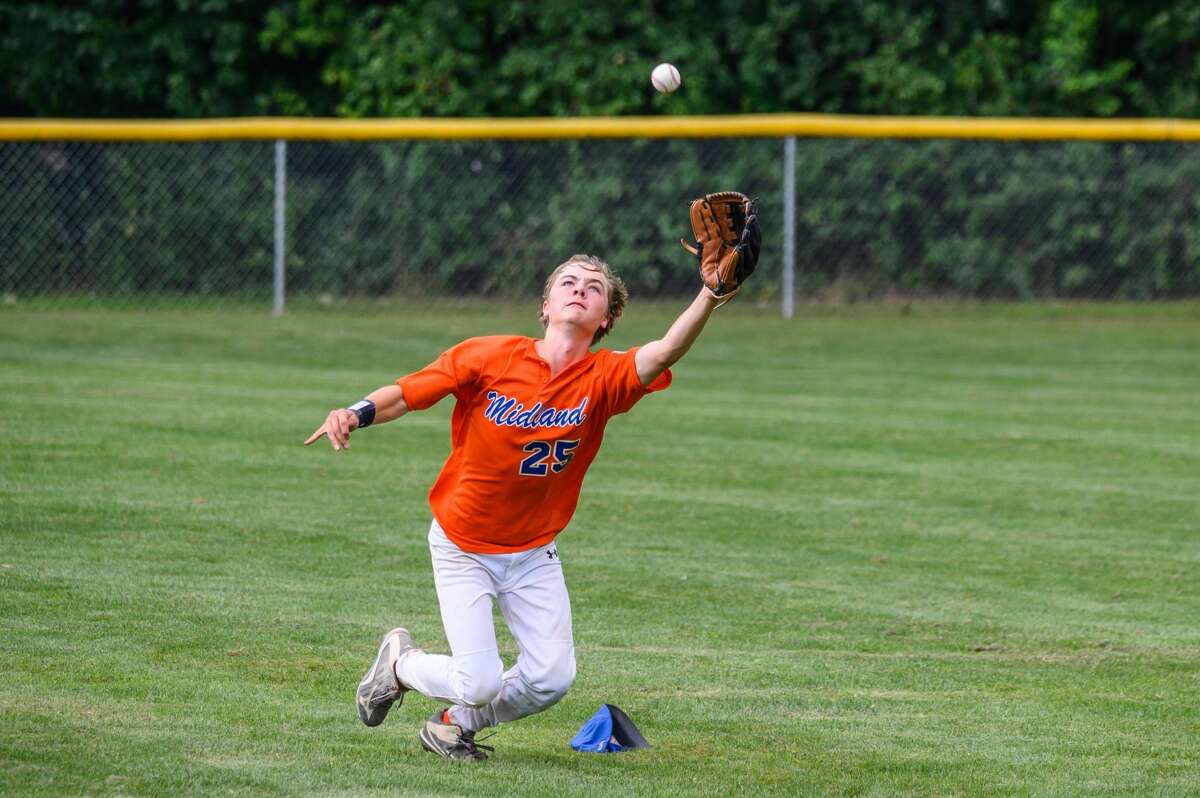 The Midland junior Little League team competes against Commerce Township during the state tournament on Sunday, July 28, 2019 in Grand Rapids. (Adam Ferman/for the Daily News)