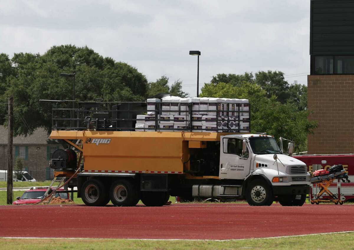 Two adult male contractors were found dead inside the seed truck barrel while working to fertilize the Wisdom High School field on Monday, July 29, 2019, in Houston. HISD Police Chief Paul Cordova said three workers were doing chemical treatment on the field Monday morning. One worker got onto the top of the truck and fell into the barrel, then the second worker went to check on him and also fell into the barrel. The third worker called 911 for help.