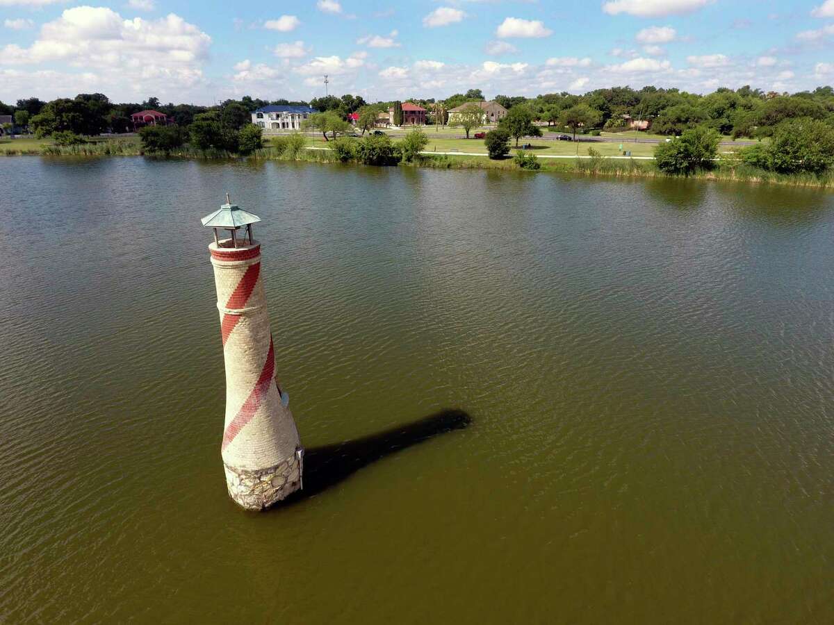 It's been the focal point of photographs, given a nautical touch to generations of Fourth of July celebrations and inspired the naming of nearby businesses, but back in the 1930s, the replica lighthouse at Woodlawn Lake was the cheapest way to spruce up the park. 