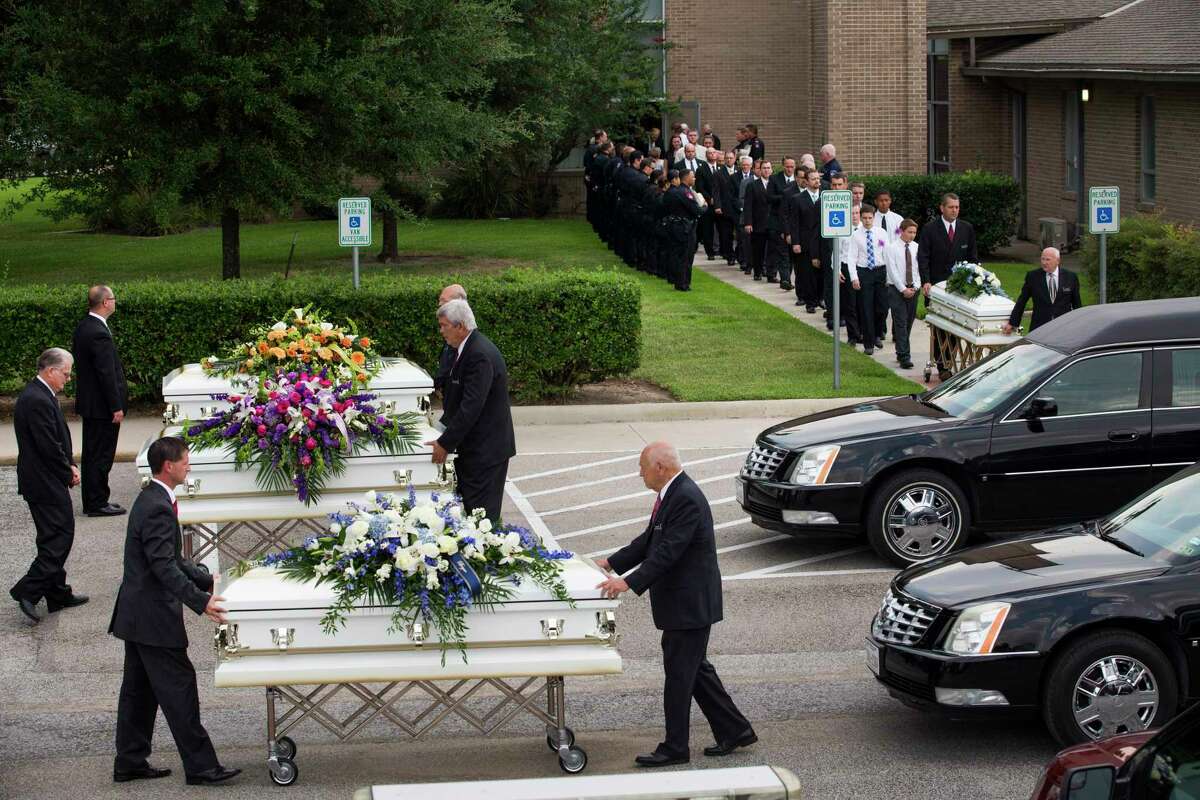 Caskets carrying the six members of the Stay family are carried from The Church of Jesus Christ of Latter-Day Saints following funeral services Wednesday, July 16, 2014, in Houston. Ronald Lee Haskell is accused of killing the family members at their Spring home.