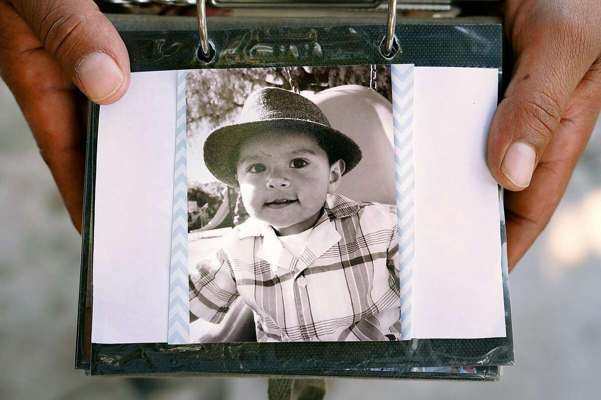 Noe Romero, 36, of Madera, holds a photo of his nephew Stephen Romero who was a victim of the Gilroy Garlic Festival shooting at the family's home in San Jose, Calif., on Monday, July 29, 2019.