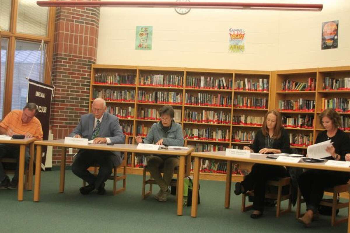 Members of the Onekama Consolidated Schools Board of Education discusses the student count at Monday's board meeting.