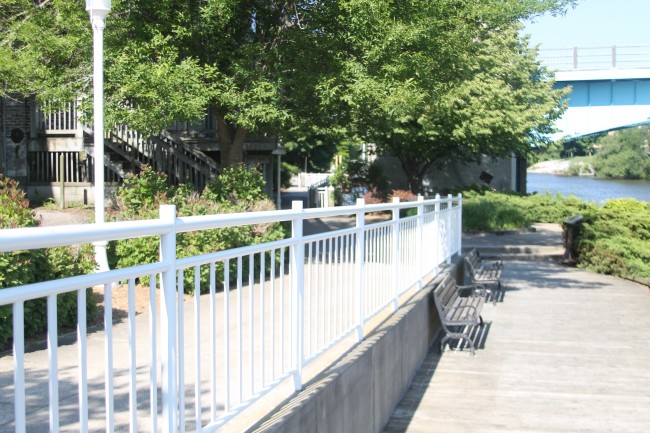 Riverwalk rail repainting in progress
