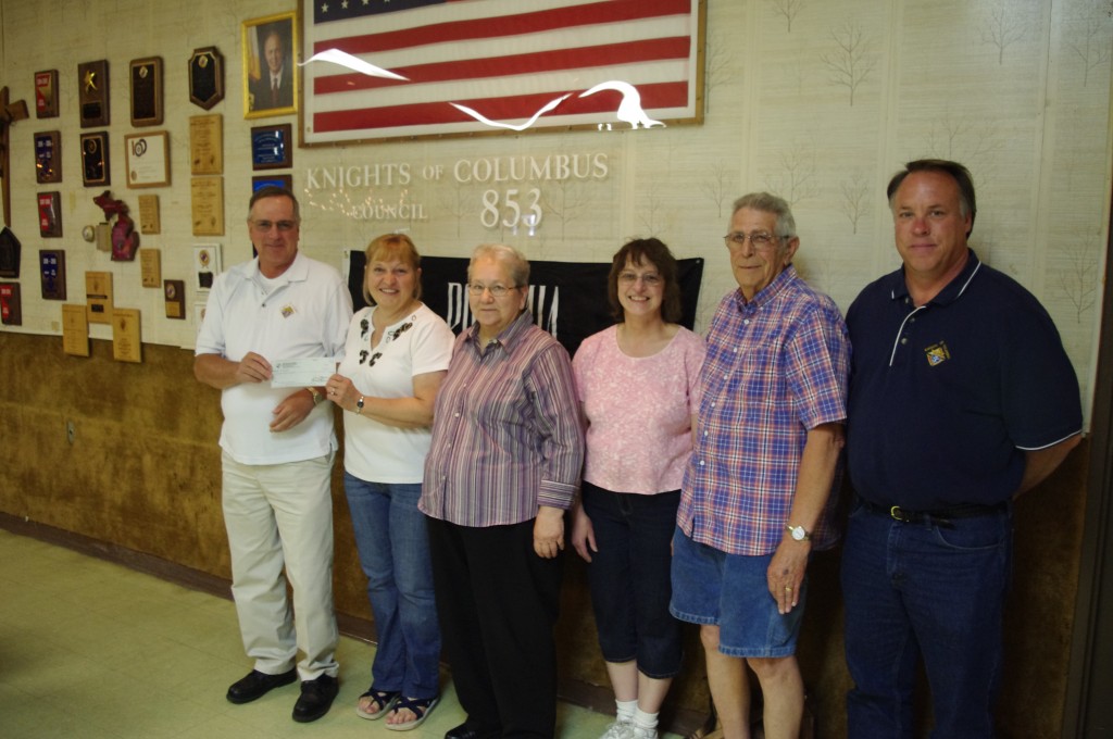 Knights Of Columbus Contribute Tootsie Roll Money To ARC