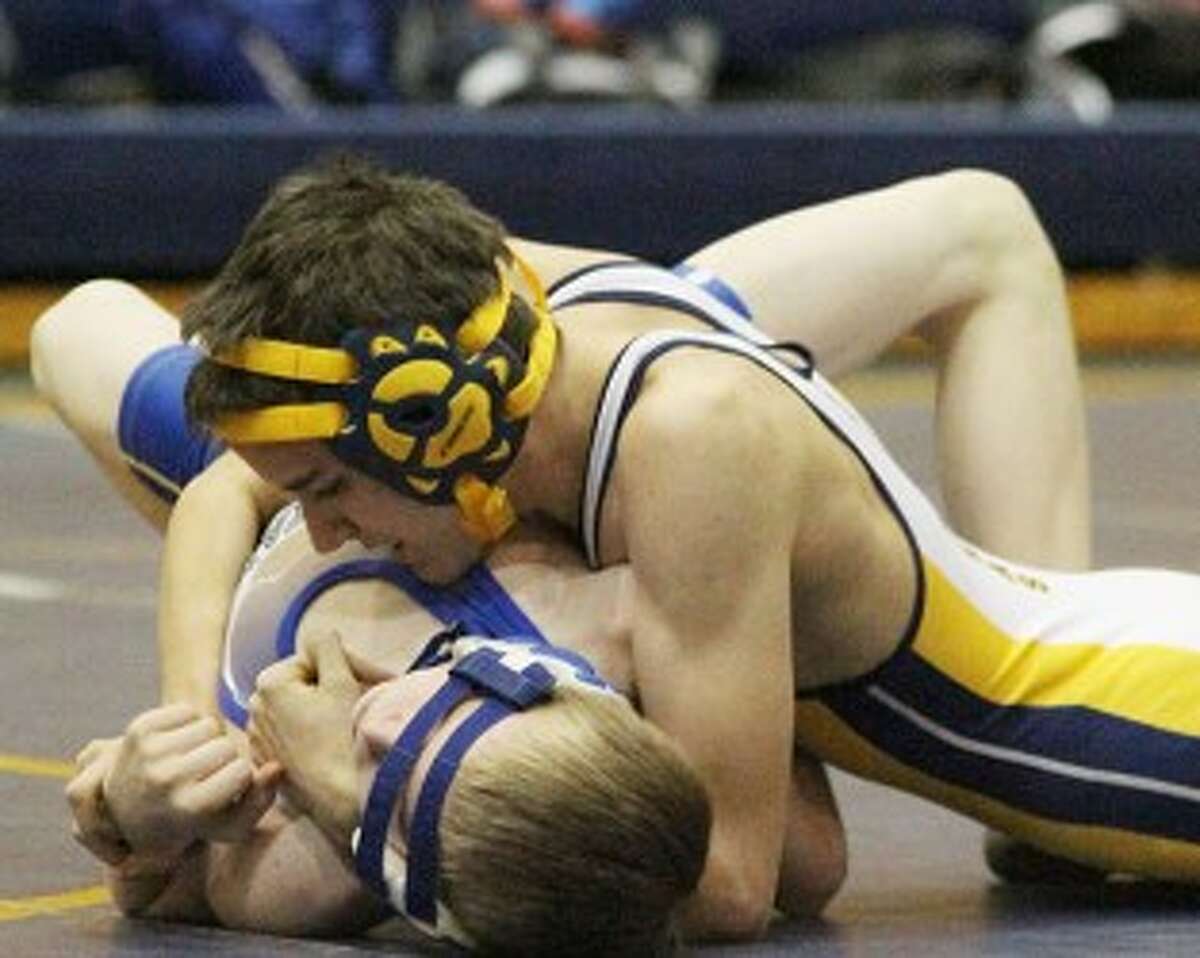 Manistee’s Joe Shannon (top) works to pin Mason County Central’s Wyatt Thompson in a 103-pound match on Wednesday. (Matt Wenzel/News Advocate)
