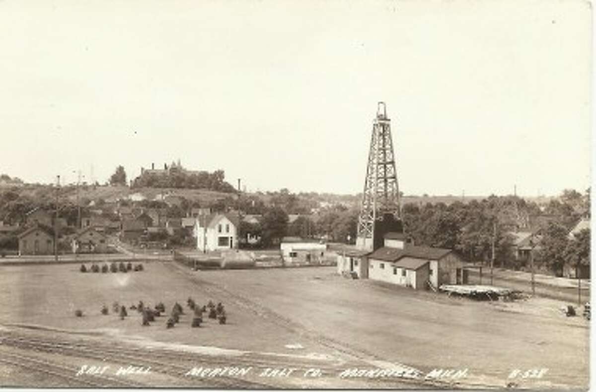 An early 1900s photo of the southern portion of Manistee and a Morton Salt brine well. Mercy Hospital is on the hill in the background. (Courtesy Photo/Dale Picardat)