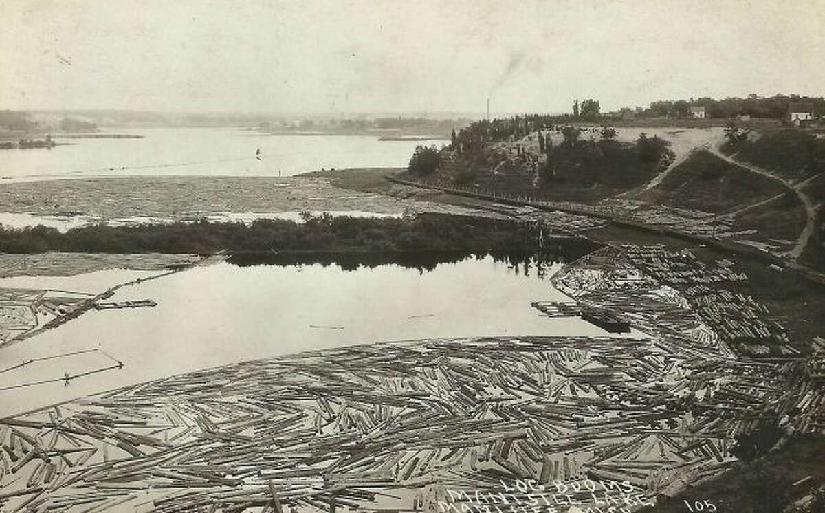 Manistee Lake is filled with logs that were floated down the rivers to the various sawmills that were located around Manistee Lake during the lumber era.