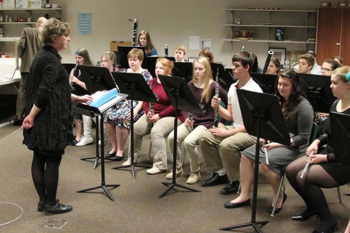 Manistee Area Public Schools director of bands Cynthia Swan-Eagan stands before an ensemble of her students at the recent state finals for solo and ensemble. Swan-Eagan is retiring this year after serving 34 years as band director.