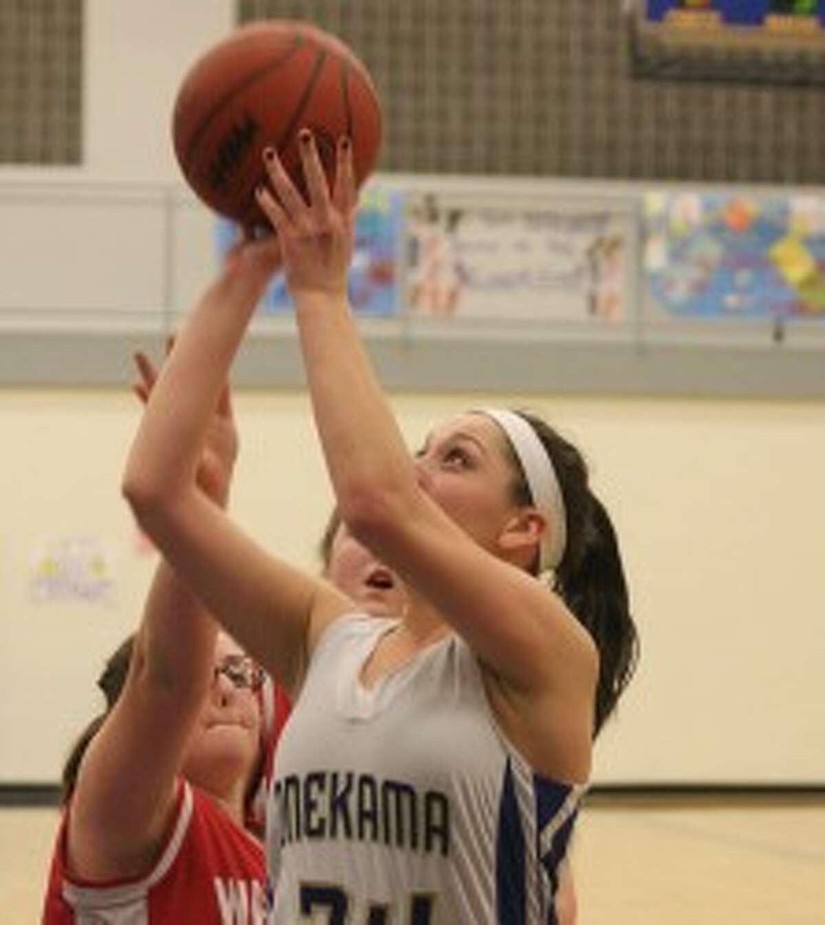 Onekama’s Hanah Gilbert (34) shoots during the second half of Thursday’s win against Walkerville. (Dylan Savela/News Advocate)