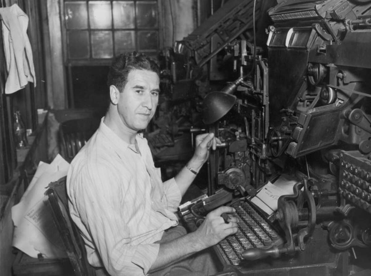 Manistee News Advocate employee Harold Edens works a lineotype machine to set the print in lead so it can be printed out on the press.