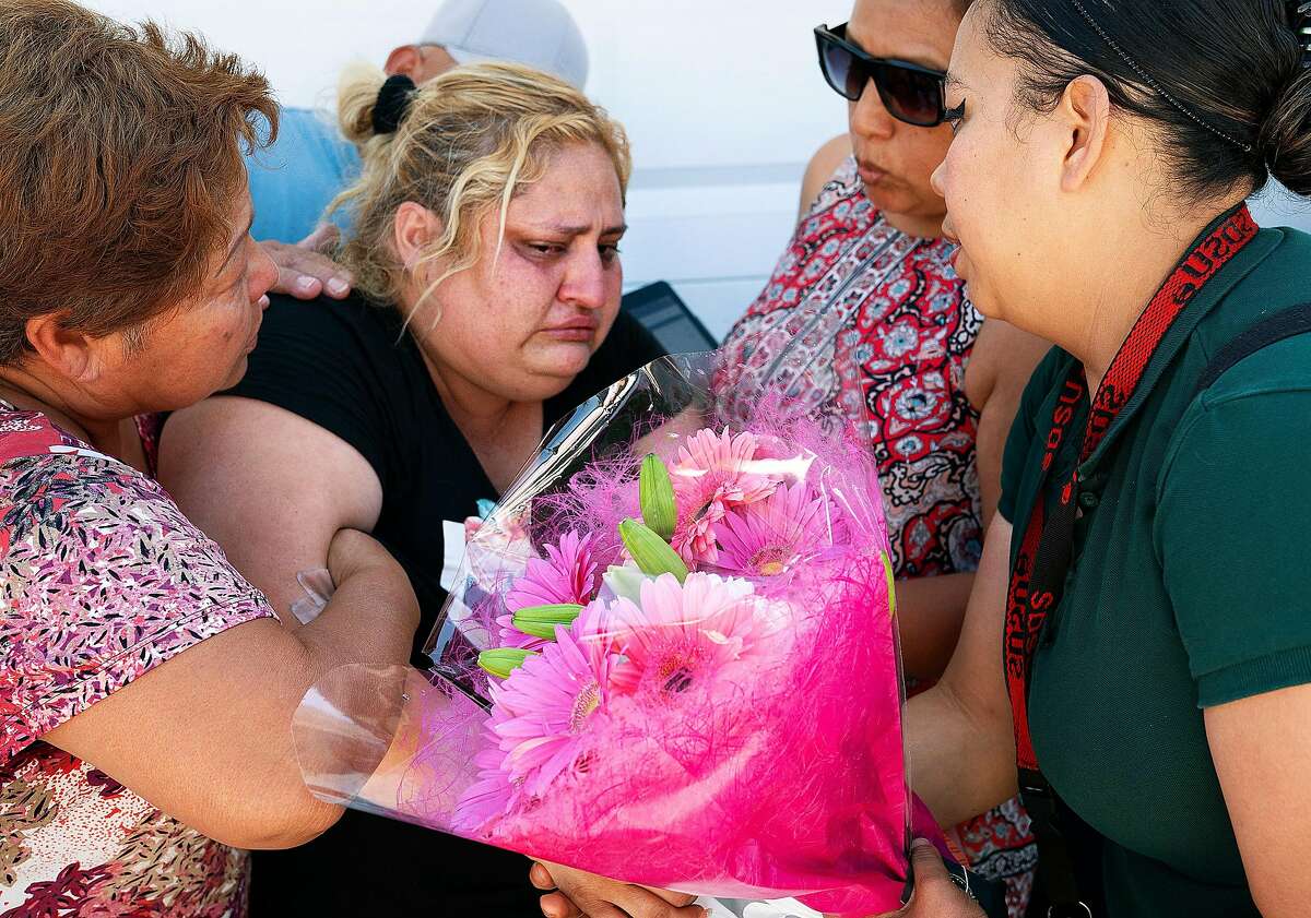 Lorena Pimentel,, center, whose daughter Keyla Salazar was killed during the shooting at the Gilroy Garlic Festival, is comforted by friends and family at her house in San Jose, Calif., on Monday, July 29, 2019.