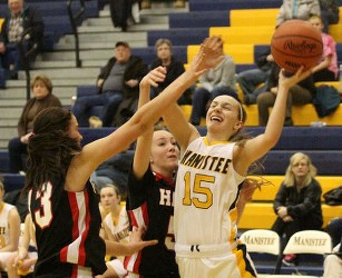 Manistee guard Emilee Kott (15) drives to the basket during the second half of Thursday’s win against Hart. (Matt Wenzel/News Advocate)