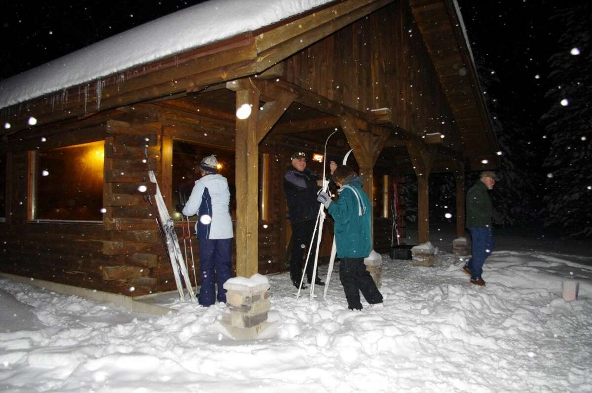 Skiers get ready to go into the Big M Lodge to enjoy warmth and refreshments. (Dave Yarnell/News Advocate)