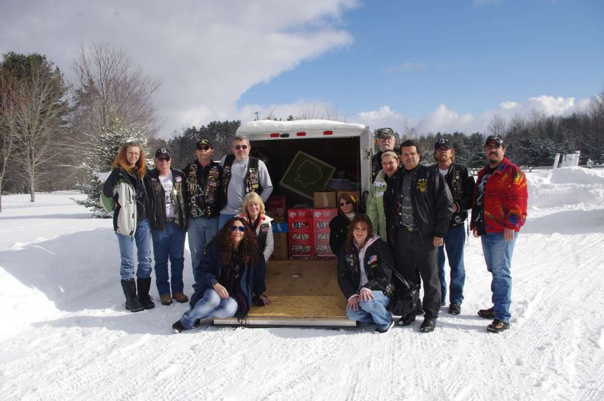 A large number of representatives from Manistee’s Rolling Thunder Michigan Chapter One made the trip Sunday to Gaylord to present a trailer full of items to the Patriot Place facility for homeless veterans. From left to right are Lori Welch, Jim Defever, Mitchell Smith, Jerry Langhann, Kelly Trudell, , Linda Stocki, Starla Owens (a Gold Star mother), Brenda Wilson, Rev. Doug Welch, Amber Brave Bull, Calvin Murphy, Marty Kensil and Bo-John Brave Bull. (Dave Yarnell/News Advocate)
