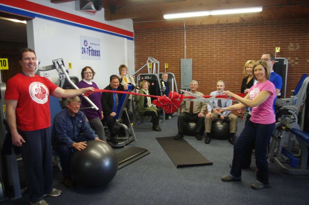 On Monday the Manistee Area Chamber of Commerce and the chamber ambassadors held a ribbon cutting ceremony at American’s Fitness Center. (Dave Yarnell/News Advocate)