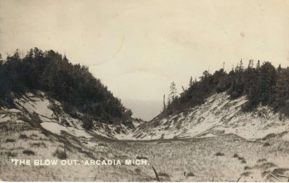 This 1930s scene shows a large blowout in the sand dunes near the Arcadia area.