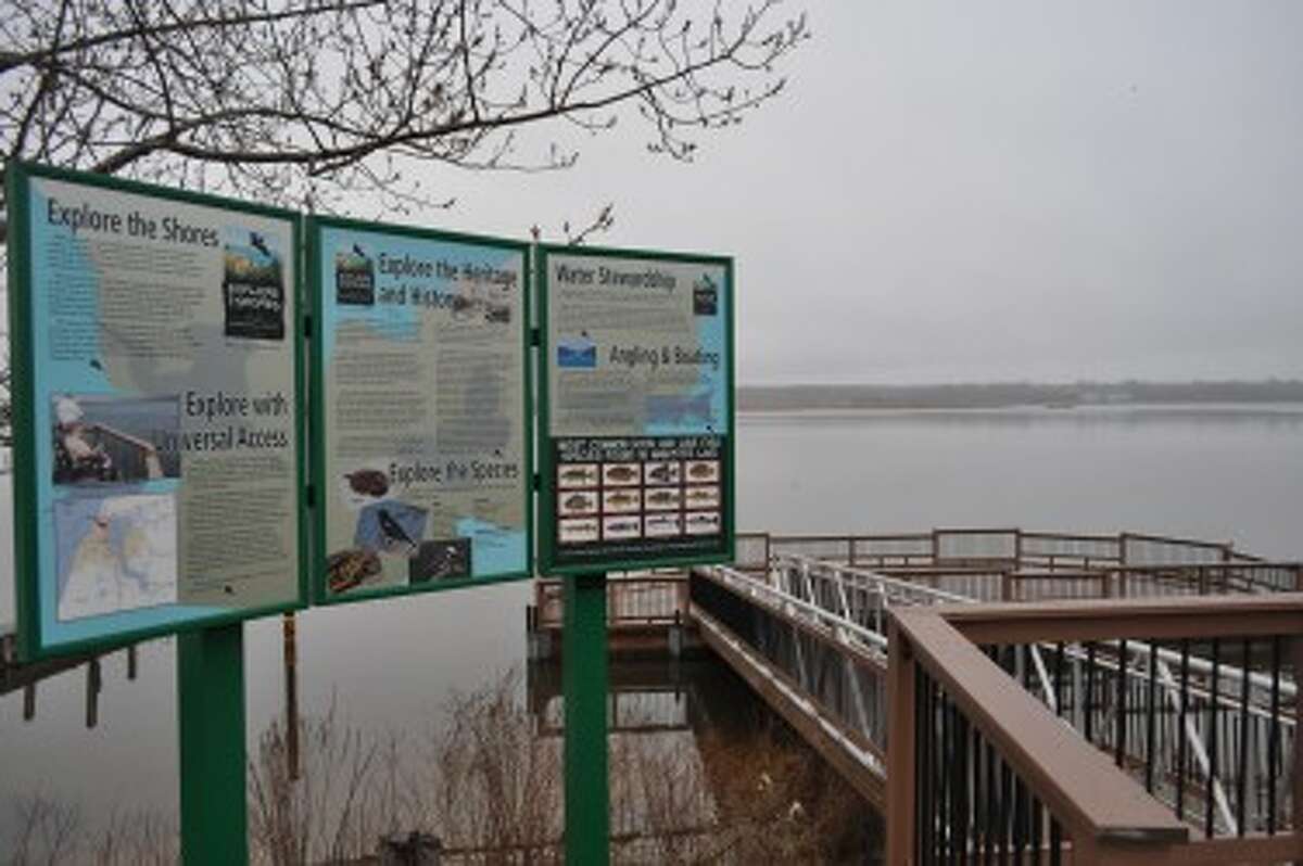 A sign explaining the Explore the Shores program at the Arthur Street boat launch and fishing pier.