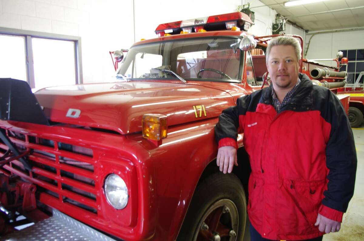 Sean Adams, Bear Lake Township fire chief, stands next to his department’s 1978 fire truck -- the first piece of equipment that will be replaced if an August millage election is successful. (Dave Yarnell/News Advocate)
