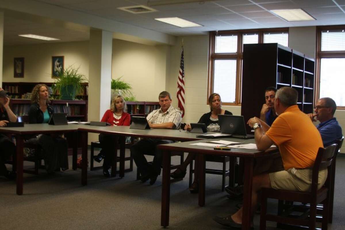 Members of the Bear Lake Board of Education listen to Marlen Cordes give a report at Wednesday's board meeting.