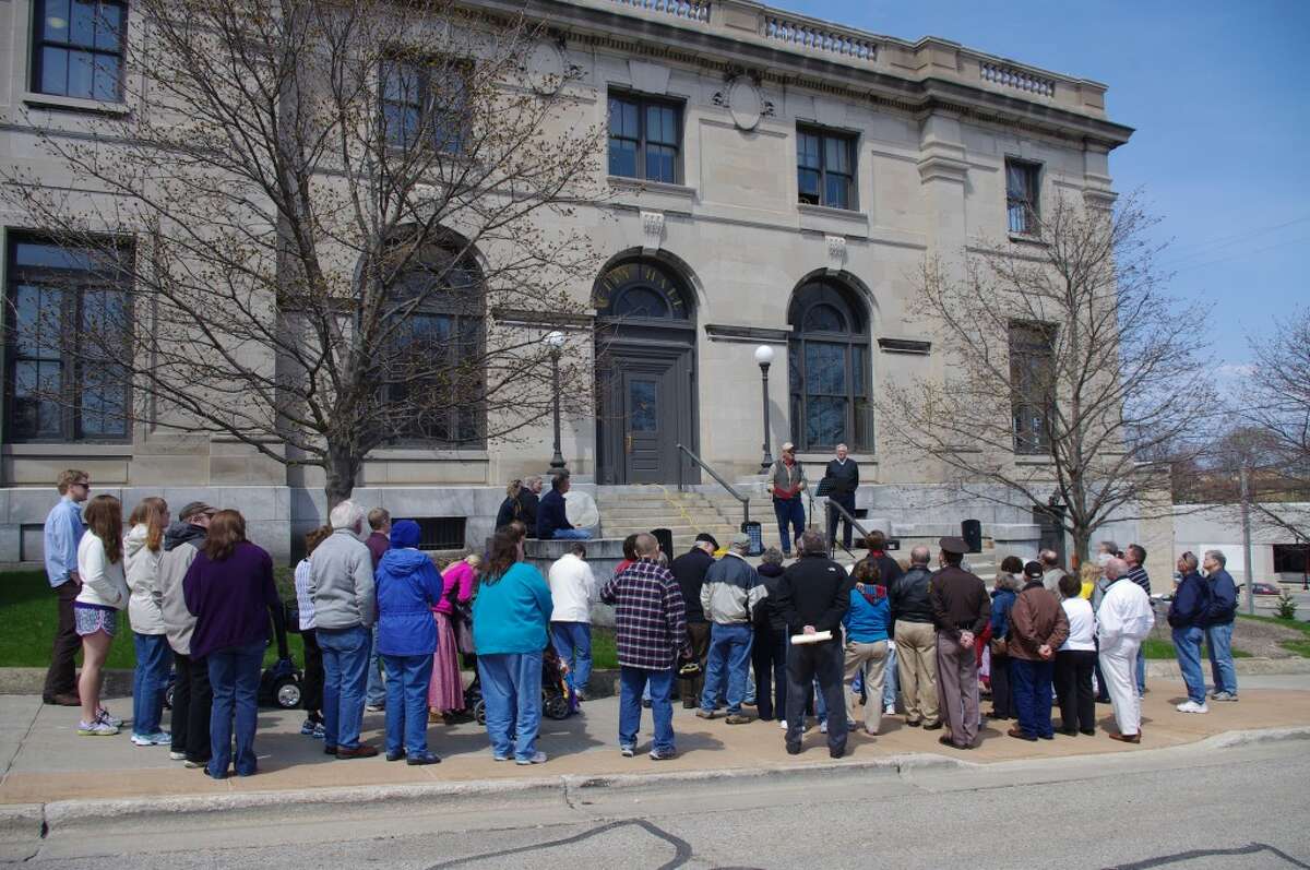 About 40 people participated in the National Day of Prayer program at noon on Thursday on the steps of Manistee City Hall. (Dave Yarnell/News Advocate)