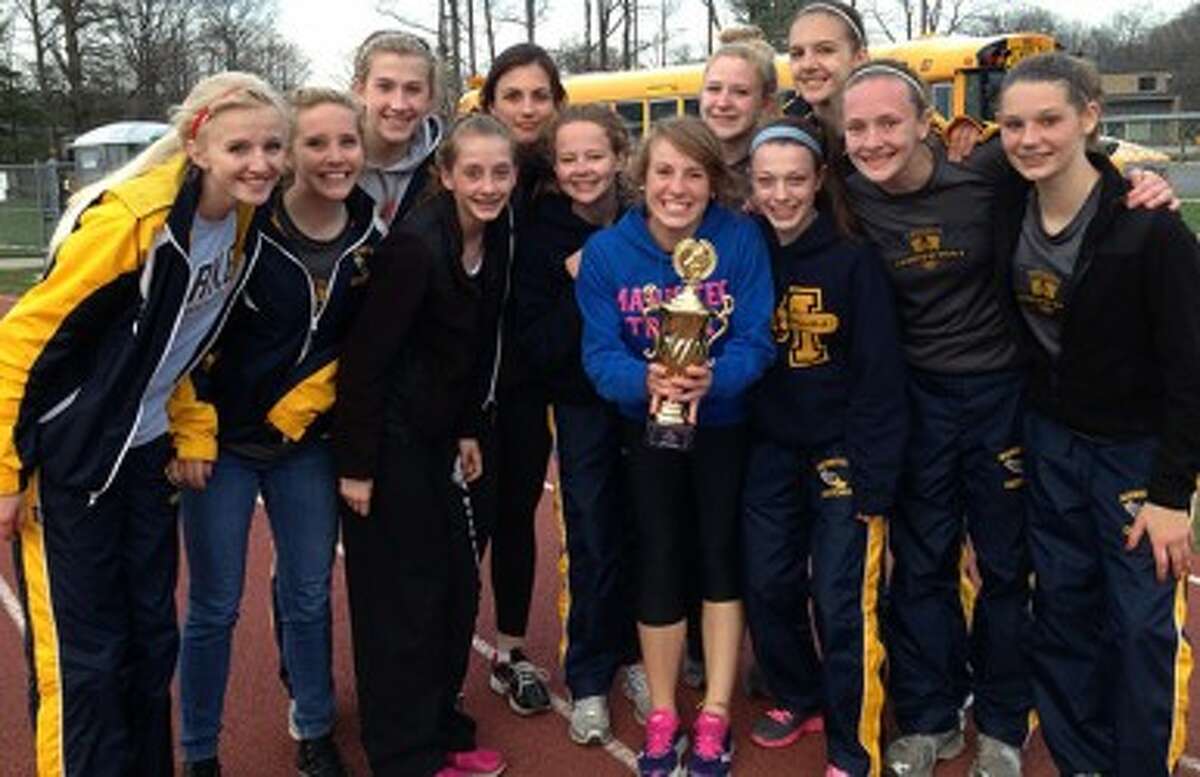 The Manistee girls track and field team poses with its trophy for being the top Division 3 team at the Ken Bell Invitational on Friday at Traverse City Central. (Courtesy photo)