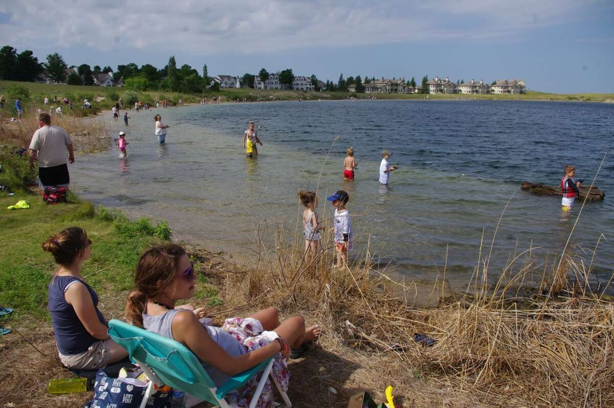 Each year, particularly when the weather is ideal, kids and their parents and grandparents surround Man Made Lake to participate in the Manistee County Sportfishing Association’s Kid Fish Day. The event will be held June 19 at Man Made Lake in Manistee. (News Advocate File Photo)