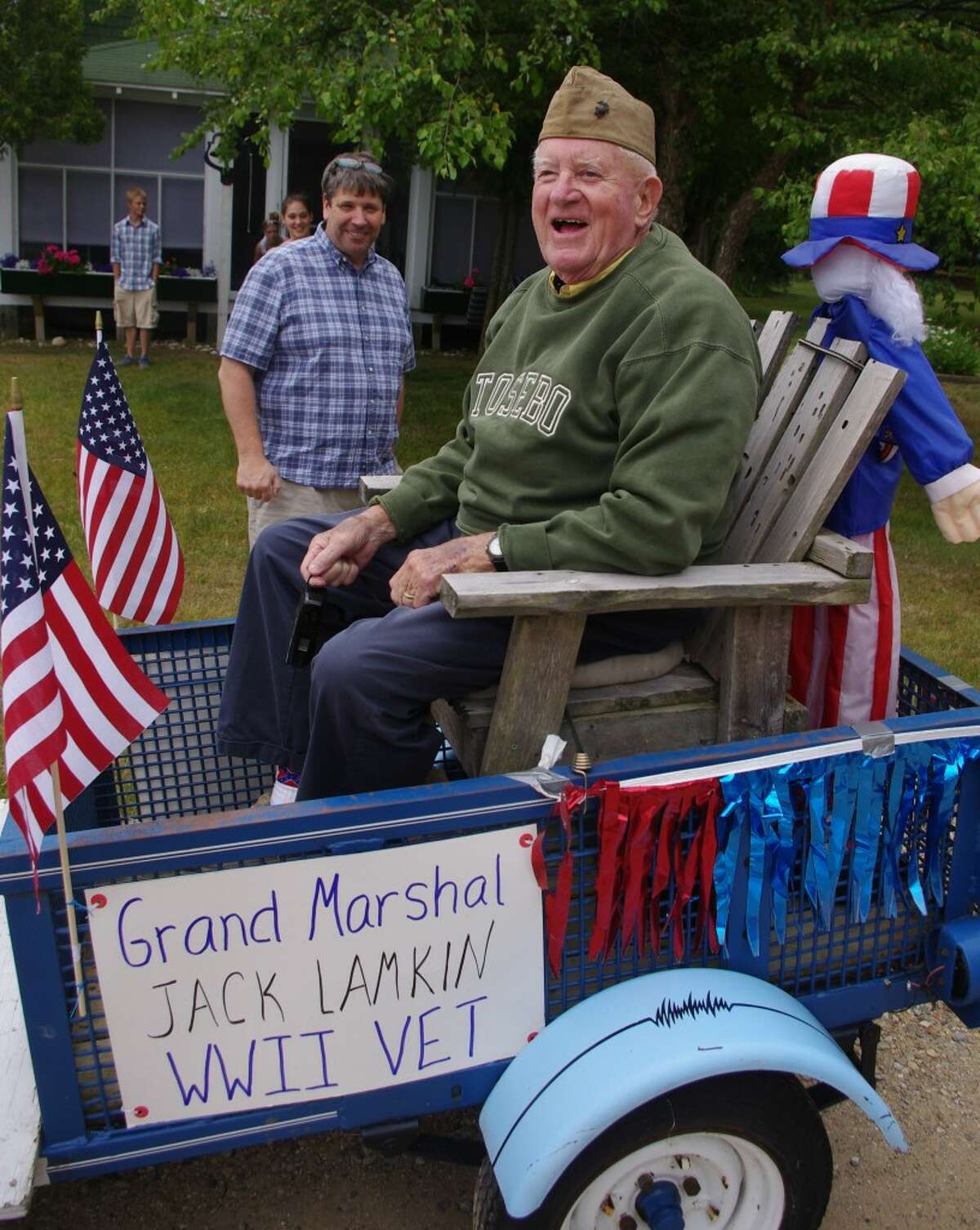 Even though the parade was just for fun, the Portage Lake south shore residents staging an Independence Day Parade on July 3 were serious when they honored Jack Lamkin, a 92-year-old World War II veteran, by making him the grand marshal. (Dave Yarnell/News Advocate)