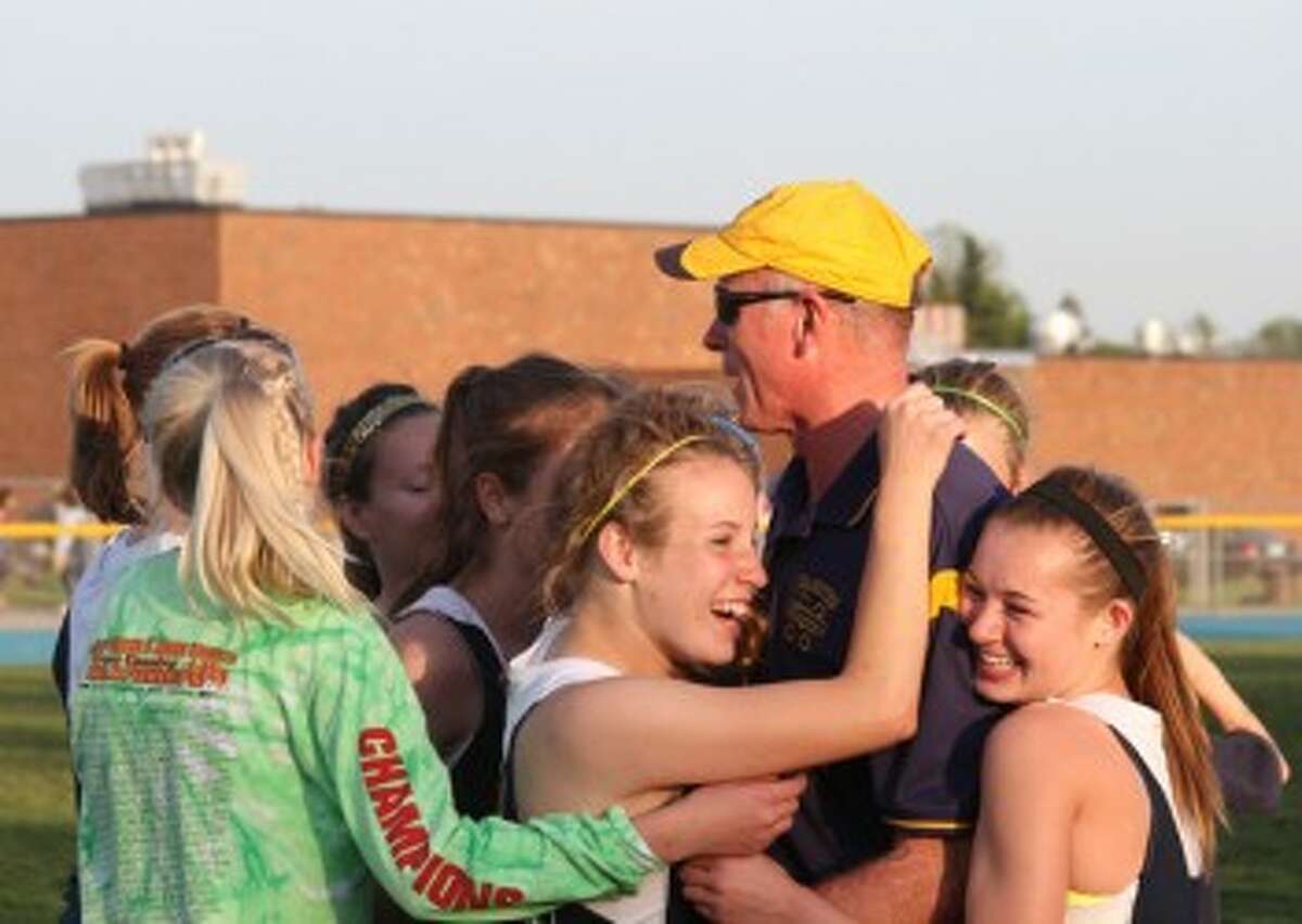 Fuller is thanked by the Manistee girls team after they won a regional in May. (Matt Wenzel/News Advocate file photo)