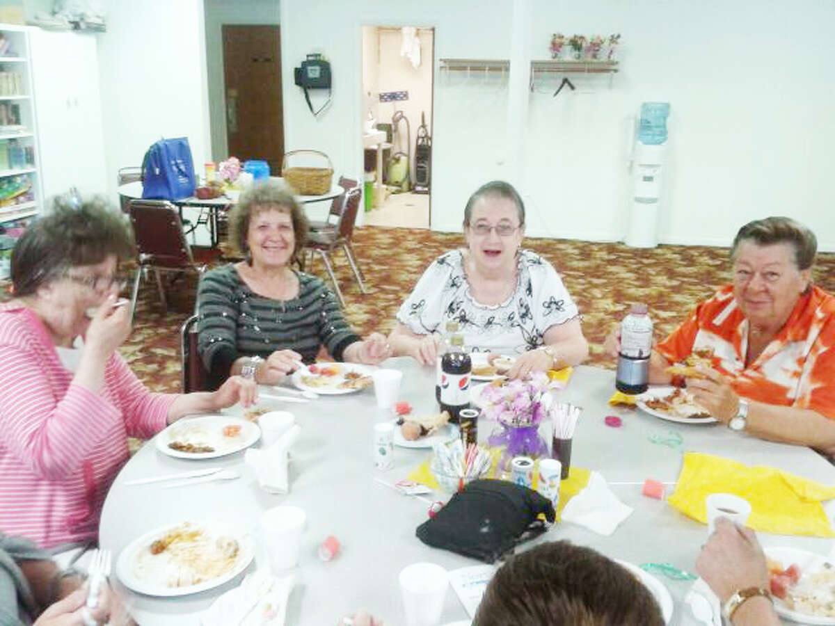 Seniors enjoy a potluck at the Manistee Senior Center last Sunday. (Courtesy photo)