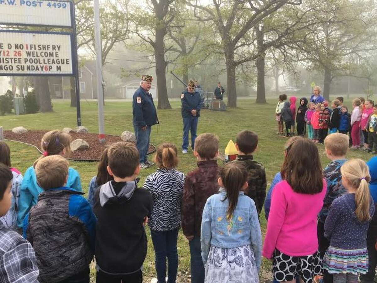 Manistee Veterans of Foreign Wars Walsh Post No. 4499 commander Don Vadeboncoeur speaks to Madison Elementary students on the importance of Memorial Day.