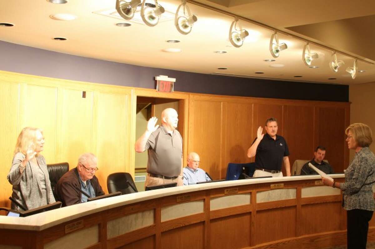 Council members Lynda Beaton (left), Chip Goodspeed (middle) and Mark Wittlieff (right) were sworn in Tuesday to the Manistee City Council during its annual organizational meeting on Tuesday in the council chambers at Manistee City Hall.