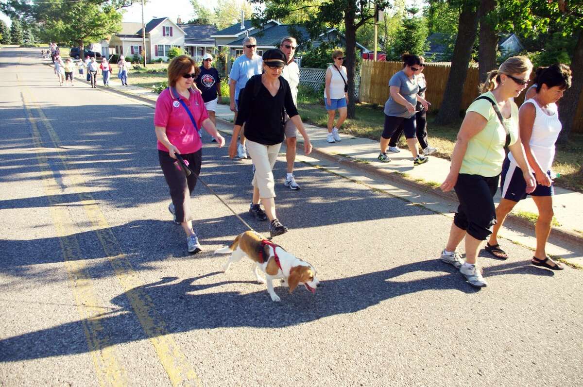 Manistee Mayor Colleen Kenny took her dog along on the Manistee Labor Day Bridge Walk. (Dave Yarnell/News Advocate)