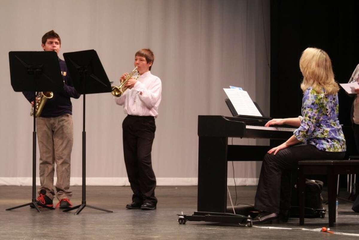 Manistee Area Public Schools middle school band members Spencer Linke and Evan Bauman accompanied by Carrie Selbee took part in Saturday's solo and ensemble event that was held at the Manistee Middle/High School.