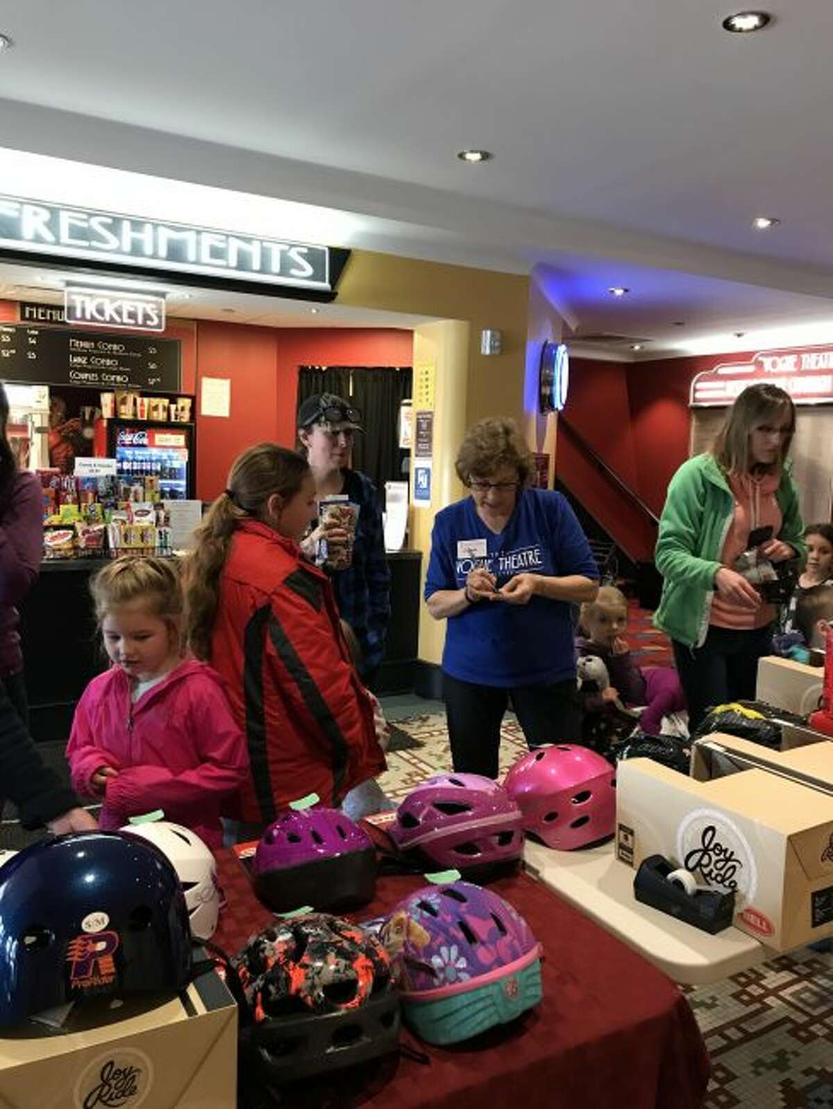 The Helmets for Kids program gave away 30 helmets at the Vogue Theatre on Saturday as part of the annual local initiative to keep children safe while riding their bicycles this summer. Organizer Clara Kahle said the program was a huge success this year.