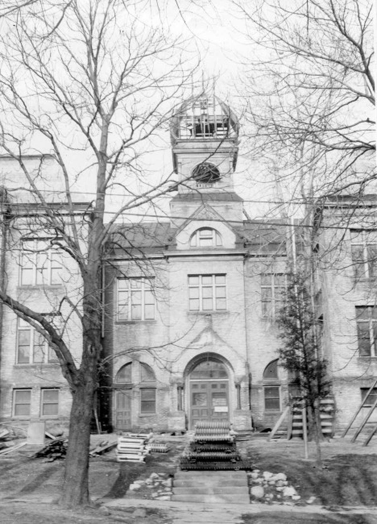 The Woodrow Wilson School that was located at the corner of Oak and First Streets is shown in this mid 150s photograph shortly before ti was torn down.