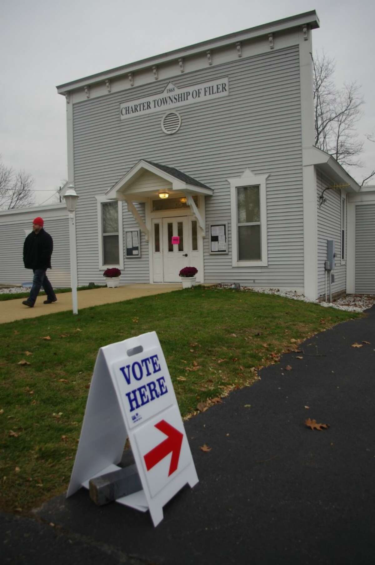 Two voters leave Filer Township Hall on Tuesday. (Dave Yarnell/News Advocate)