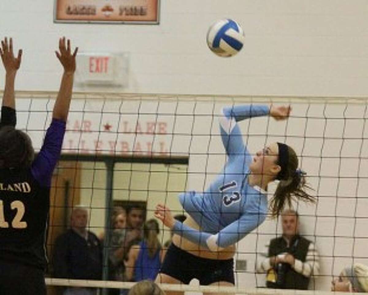 Brethren senior Annie MacNeil (13) elevates for a spike during Thursday’s five-game Class D regional final loss to Leland at Bear Lake. (Dylan Savela/News Advocate)