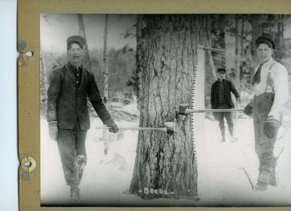 These two lumberjacks take a break from their hard work in the Manistee National Forest to pose for a photograph in the late 1890s.