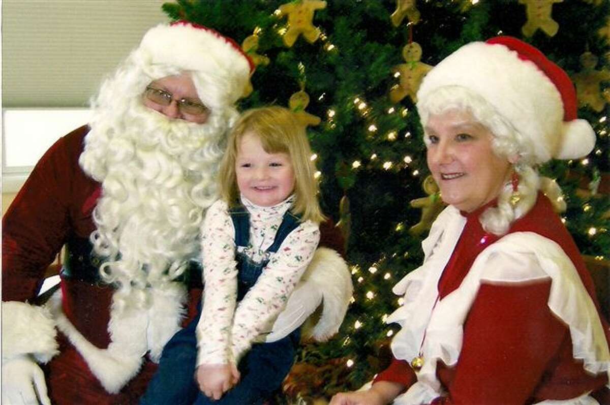 Haley Jo Mathieu talks with Santa last year at the Farr Center in Onekama. Santa will be visiting again this year from 11 a.m. to 1 p.m. (Courtesy Photo)