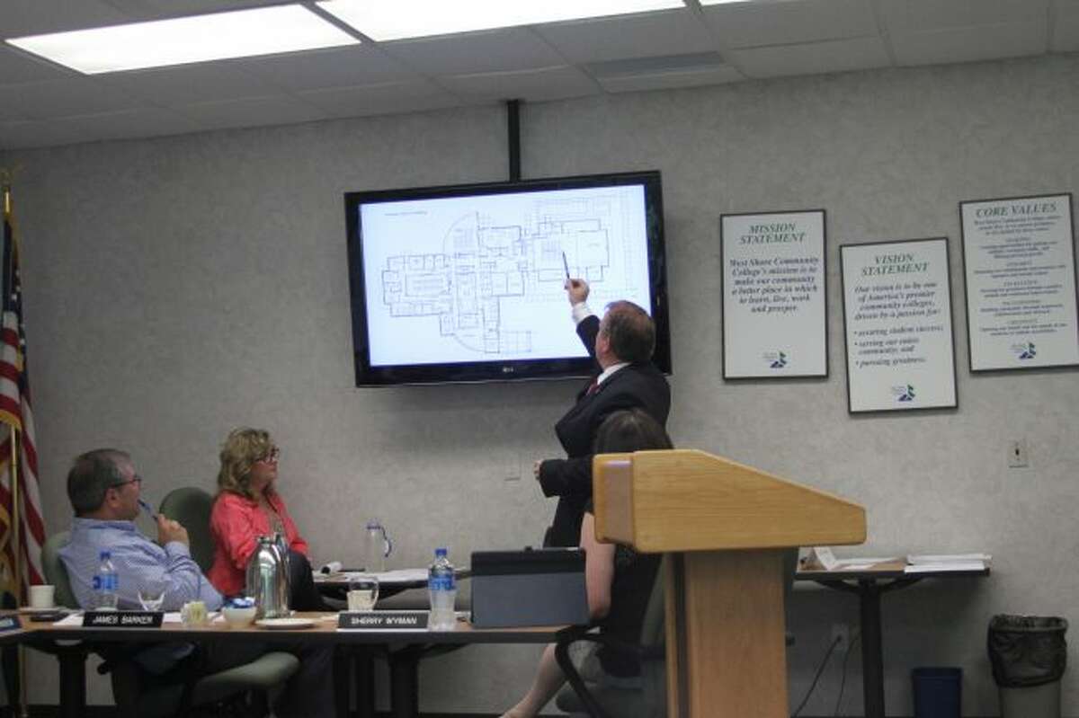 West Shore Community College president Scott Ward points to blue prints on three building projects that the college will be undertaking in the upcoming months. Improvements will be coming to the Regional Public Safety Training Center, the Ice Arena and the Tech Center buildings.