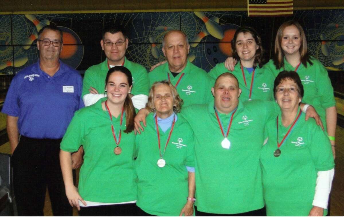 Members of the Area 24 Special Olympics unified bowling team are, left to right (front row) Michelle Heremans, Donna Nichols, Erik Boerema, Cindy Boerema, (back row) Jerry Shangle (area director and coach), Tony Griswold, Grant Griswold, Beth Shangle and Keri Shangle. (Courtesy Photo)