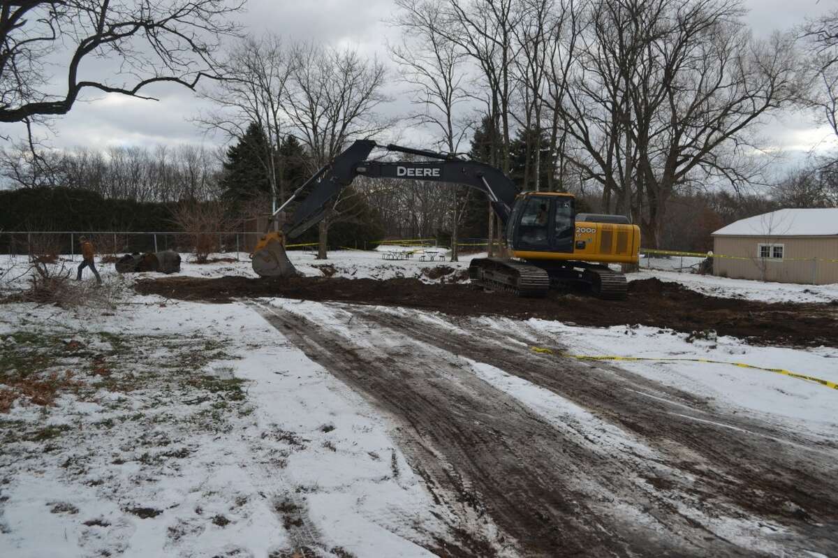 A backhoe works on the site of the demolished Parkdale School. (Meg LeDuc/News Advocate)